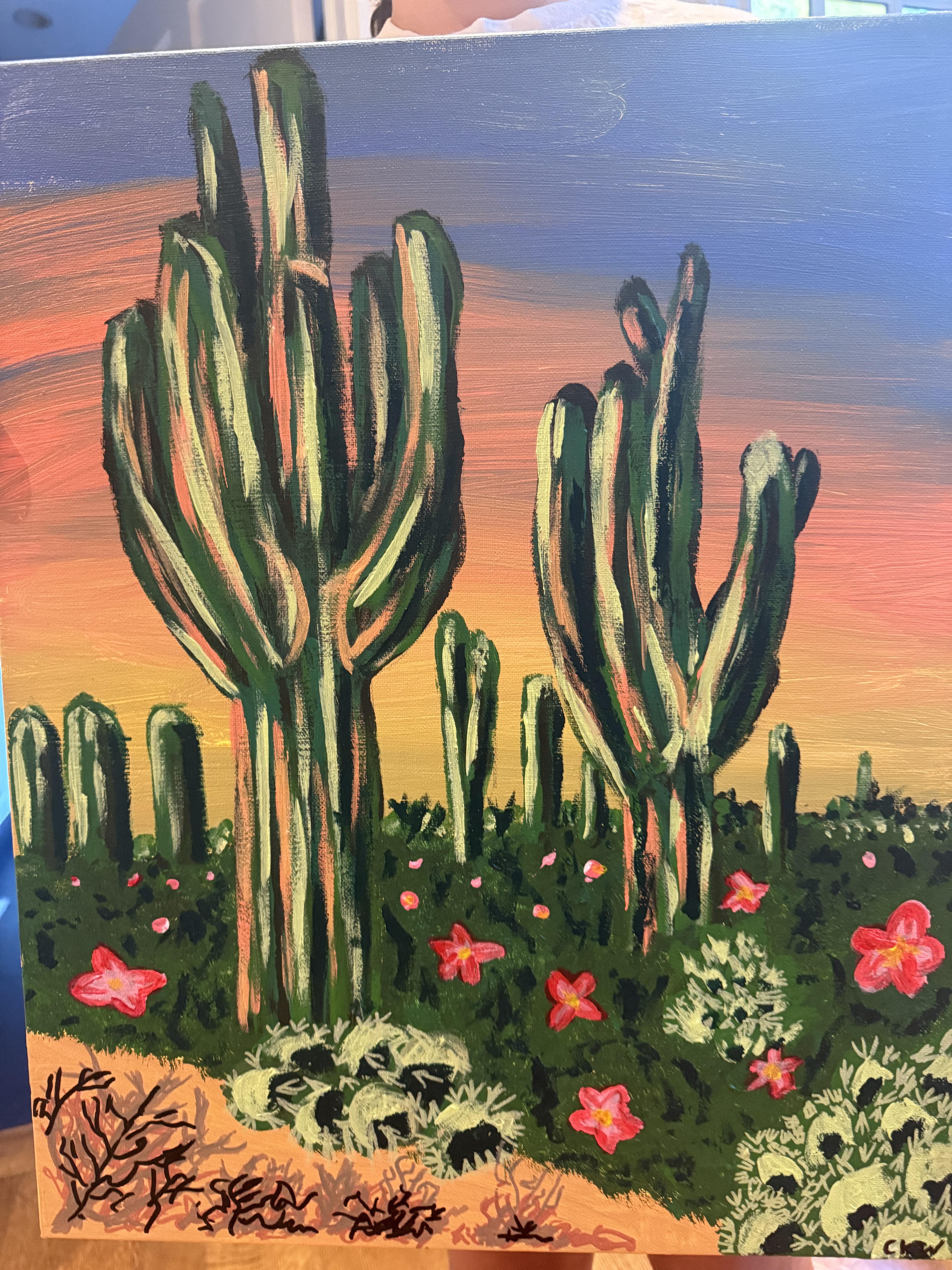 Cactus landscape painting, featuring two prominent green cactuses with organge and yellow hues in the sunset